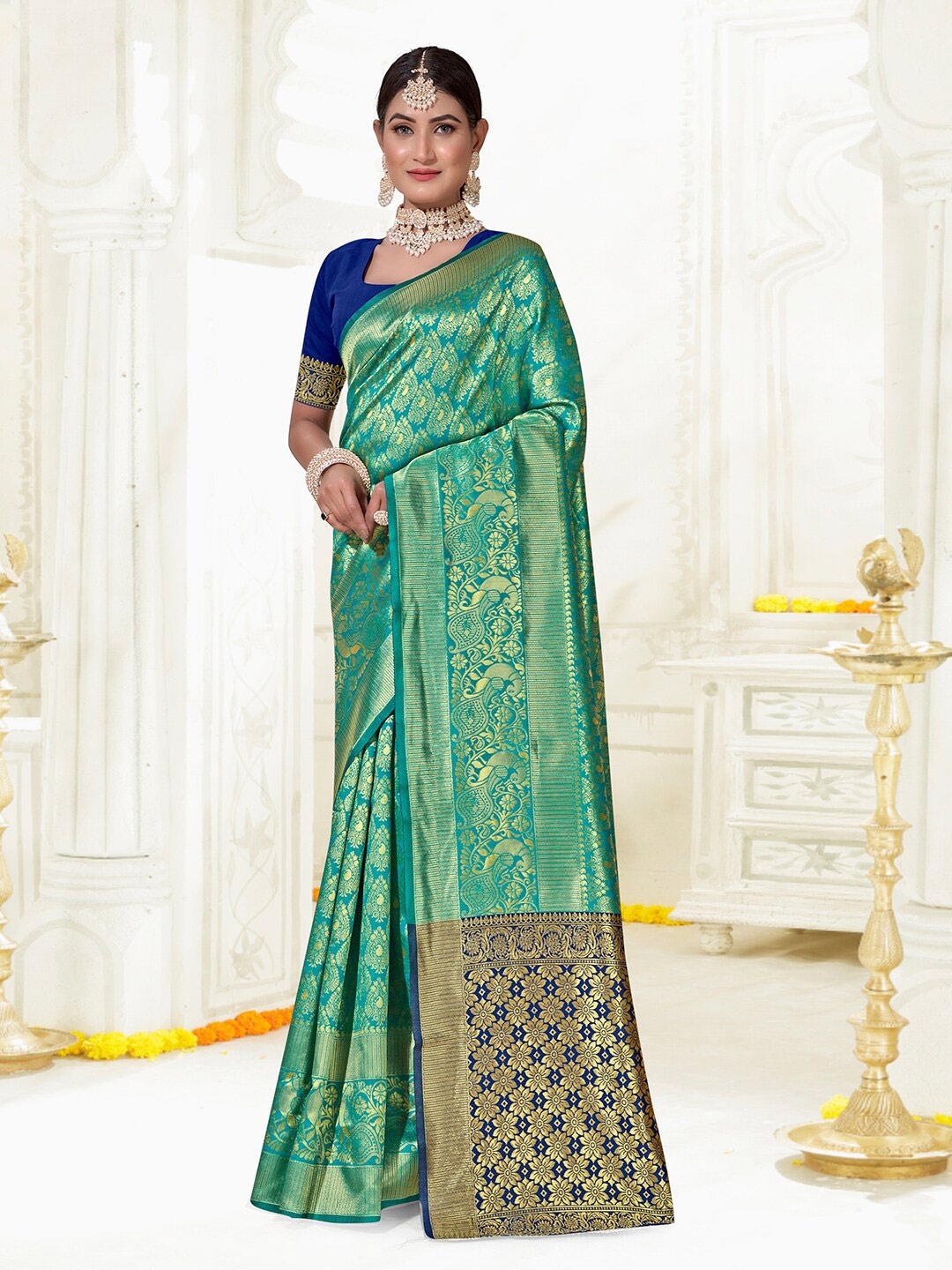 

Anouk Turquoise Blue & Blue Ethnic Motifs Woven Design Zari Kanjeevaram Saree