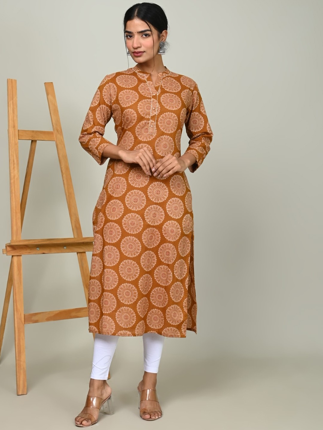 

Nishika Ethnic Motifs Printed Mirror Work Pastels Kurta, Mustard