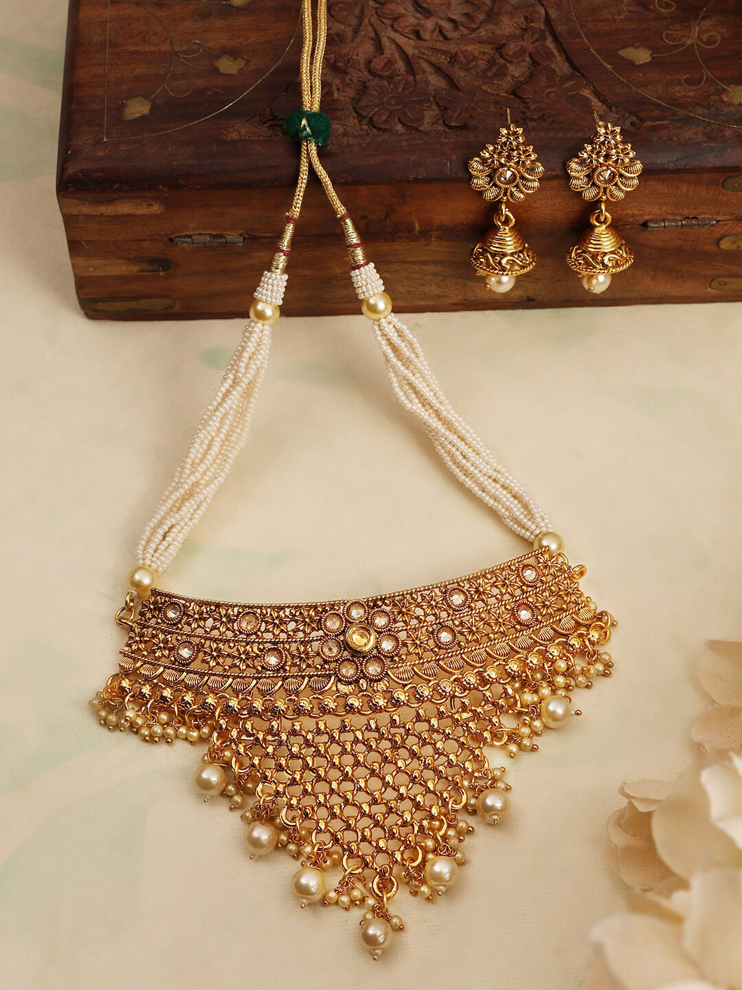 

ANIKAS CREATION Gold Plated AD Studded & Beaded Jewellery Set