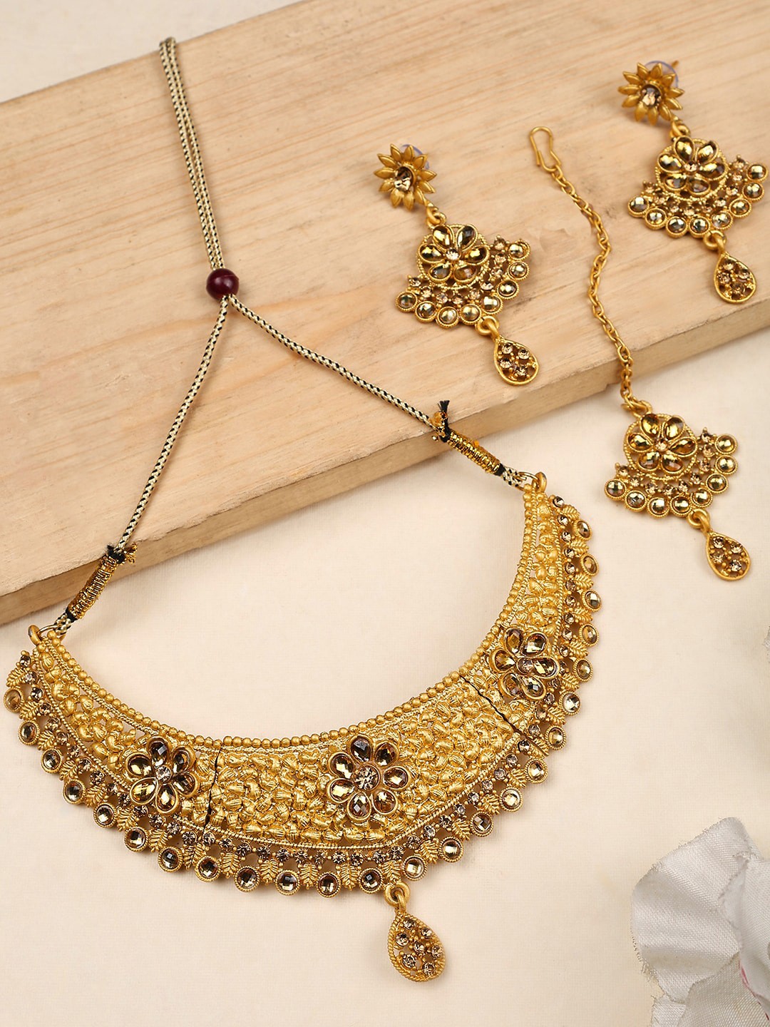 

ANIKAS CREATION Gold Plated Cubic Zirconia Studded Jewellery Set
