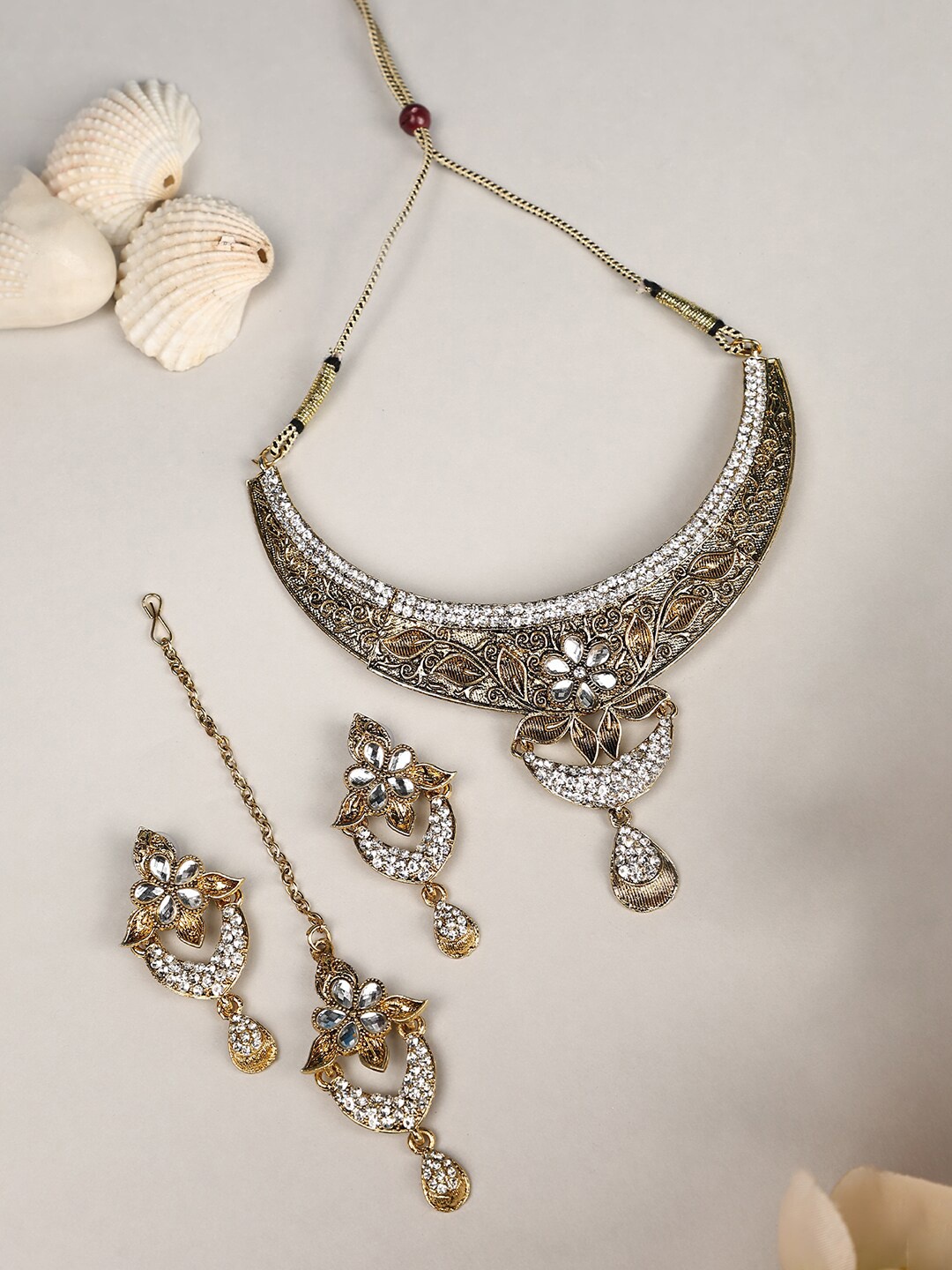 

ANIKAS CREATION Gold Plated Cubic Zirconia Studded Jewellery Set