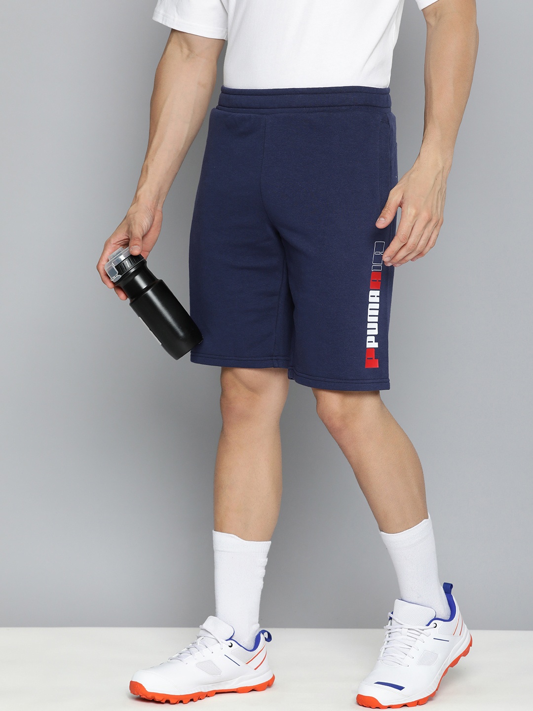 

Puma Men ESS LOGO LAB Typography Printed Shorts, Navy blue