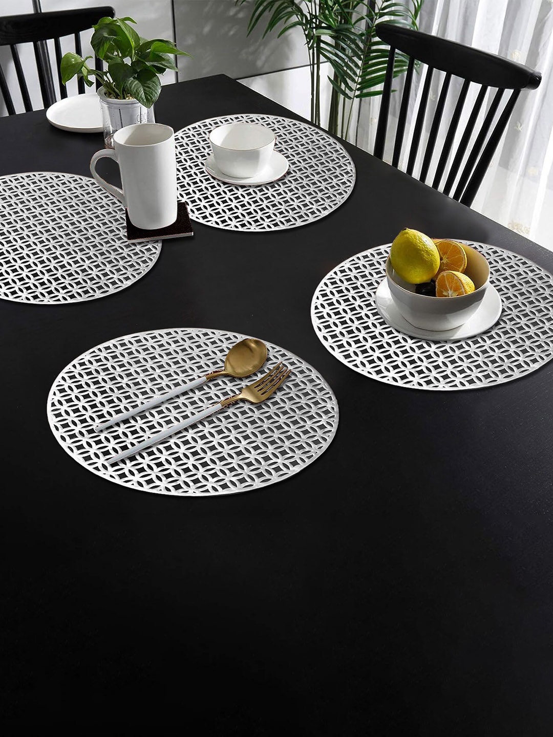 

Dakshya Industries Silver-Colored 4-Pieces Textured Round Table Placemats