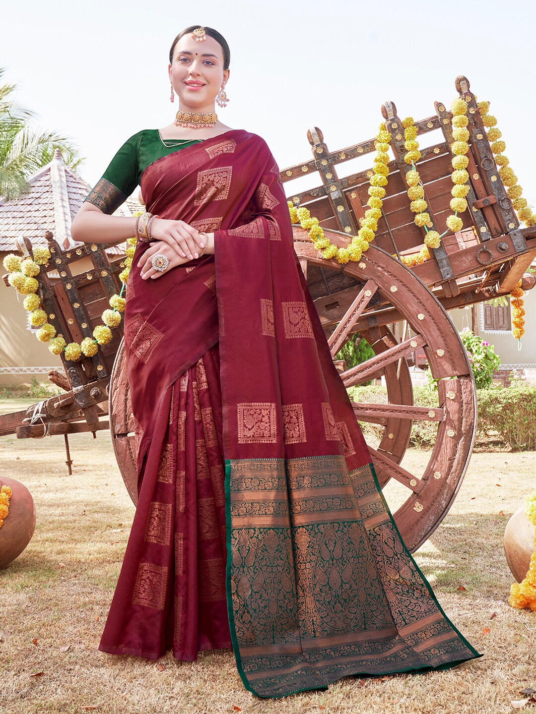 

Anouk Maroon & Green Ethnic Motif Woven Design Zari Organza Saree