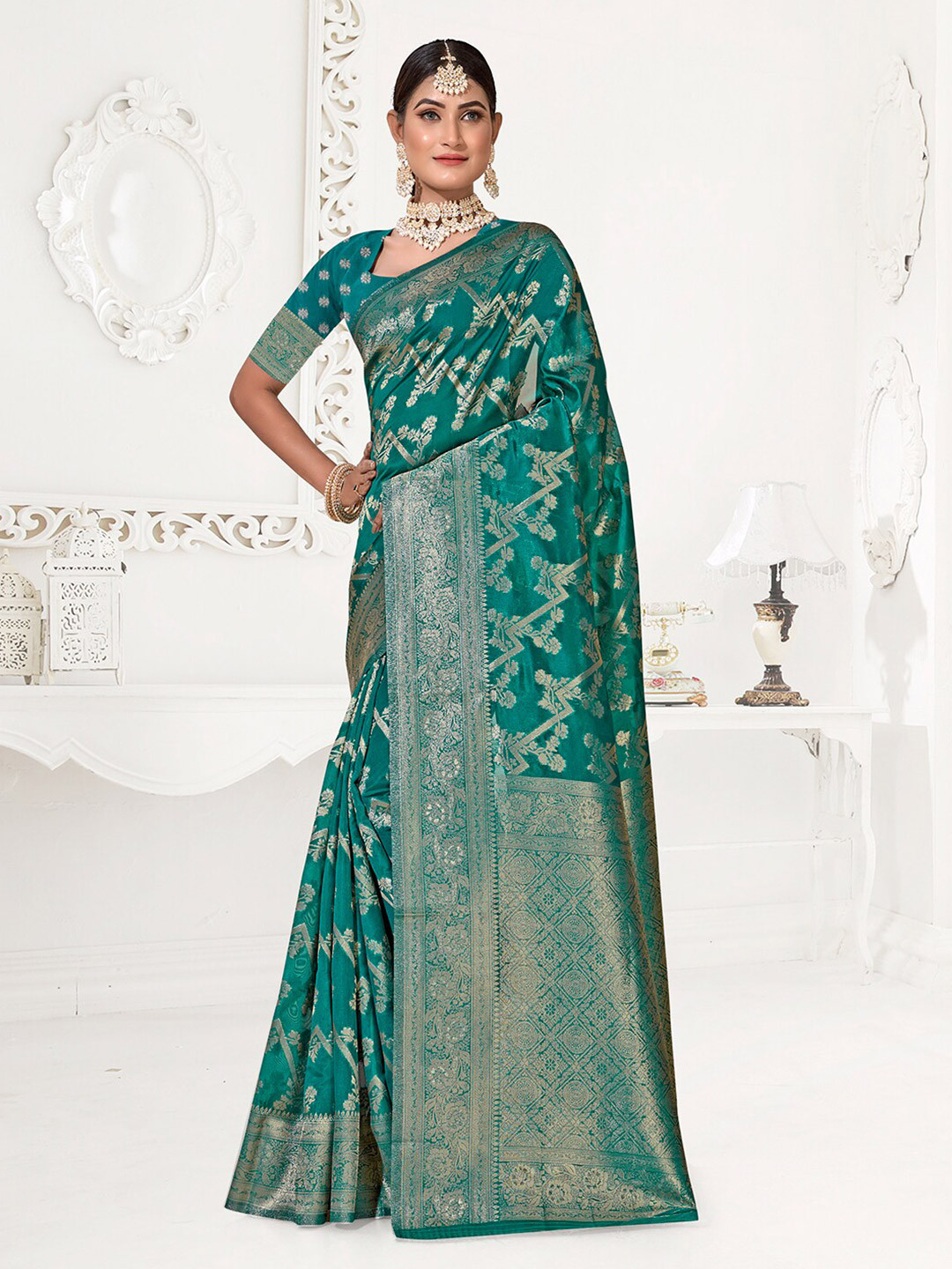 

Anouk Turquoise Blue & Gold-Toned Ethnic Motif Woven Design Zari Organza Saree