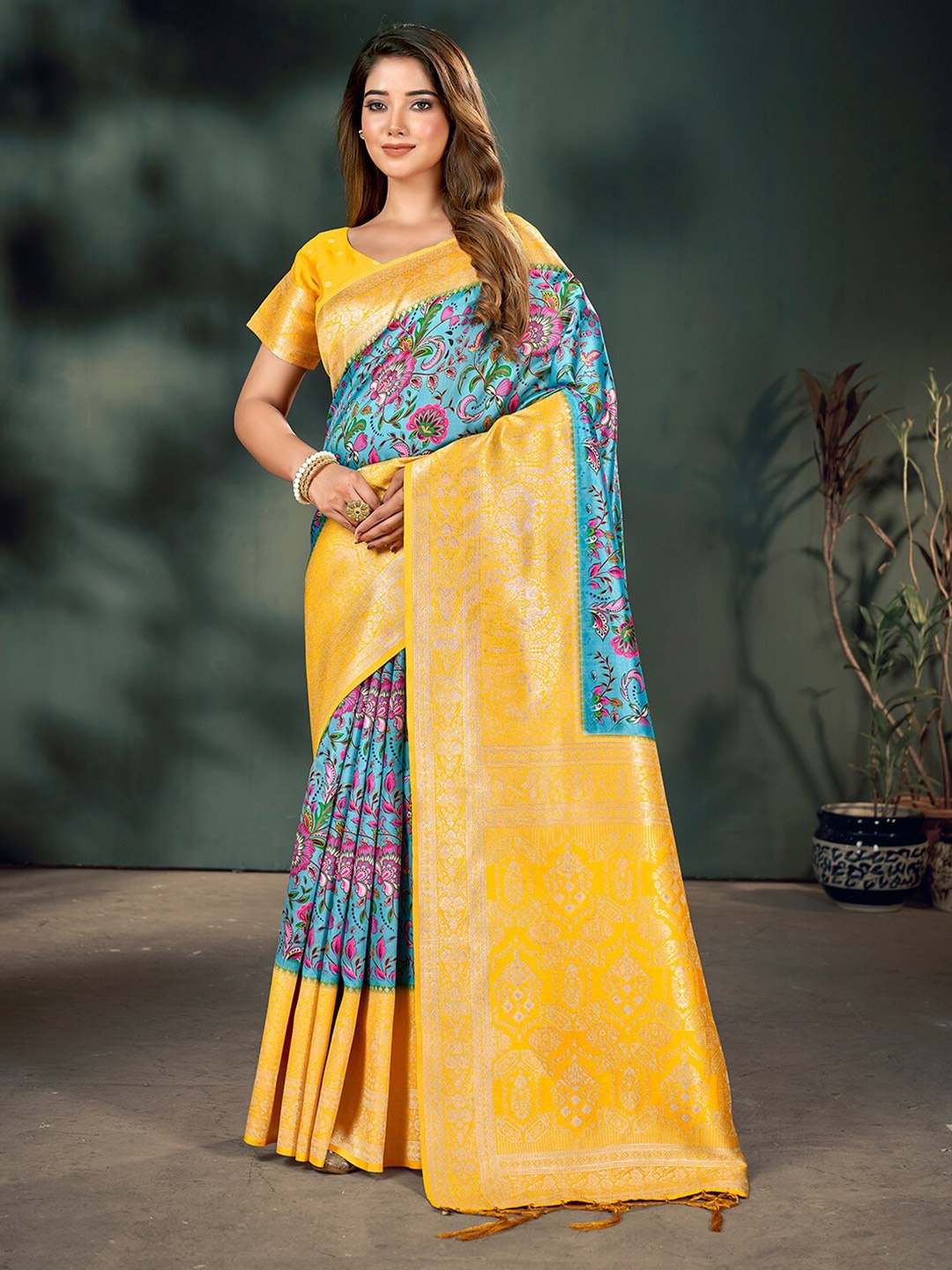 

Mitera Blue & Yellow Ethnic Motifs Printed Zari Banarasi Saree