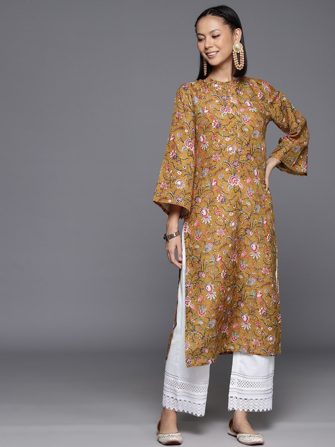 

Varanga Women Floral Printed Flared Sleeved Straight Woolen Kurta, Mustard