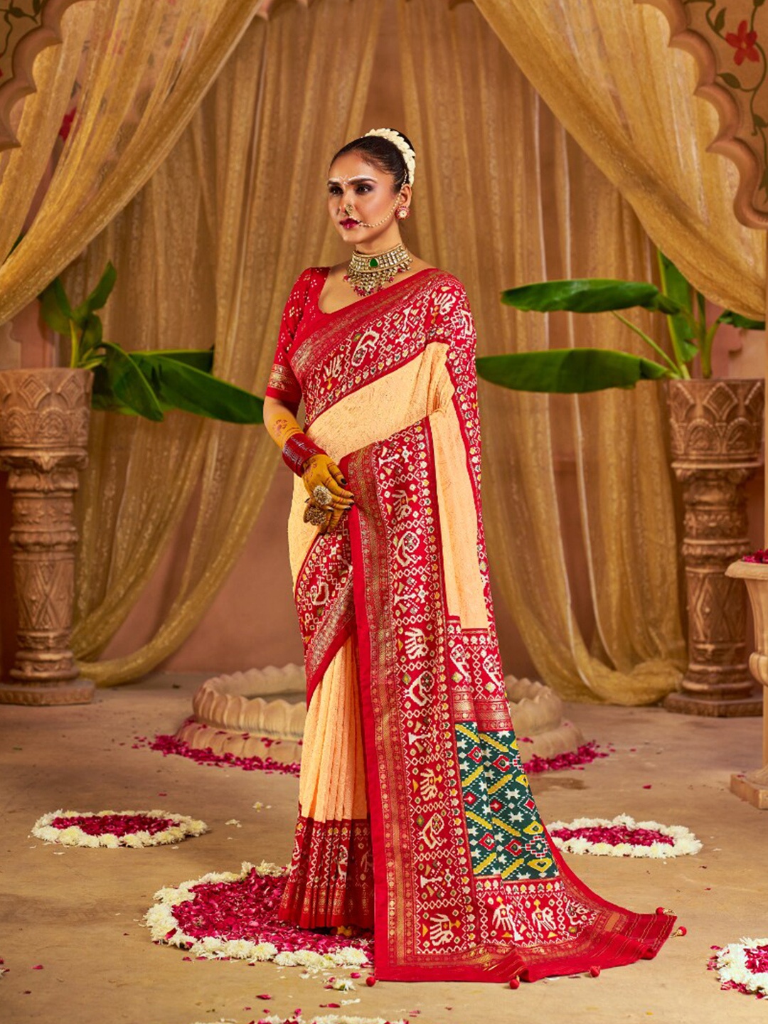 

Mitera Cream-Coloured Ethnic Motifs Printed Zari Patola Saree