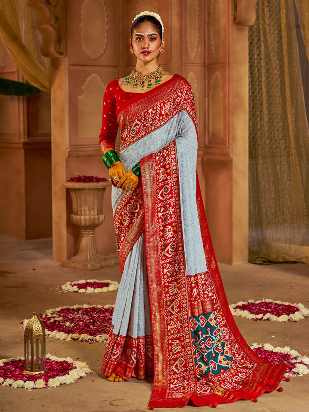 

Mitera Silver-Toned & Red Ethnic Motifs Printed Zari Patola Saree