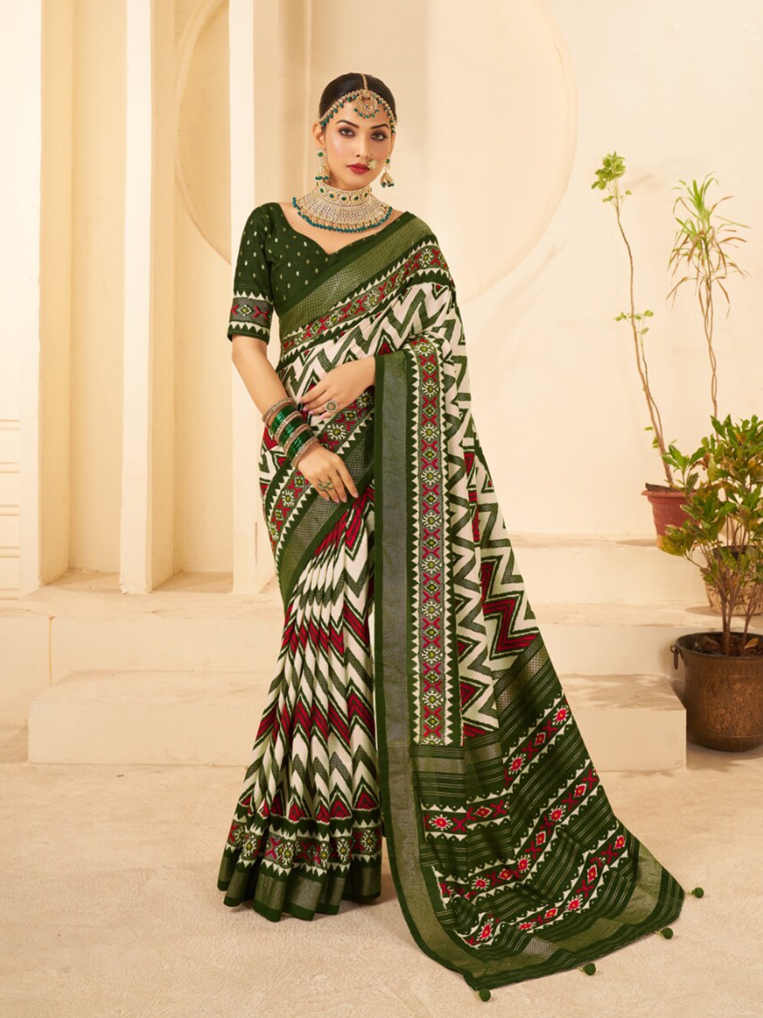 

Mitera Green Ethnic Motifs Printed Zari Silk Cotton Ikat Saree