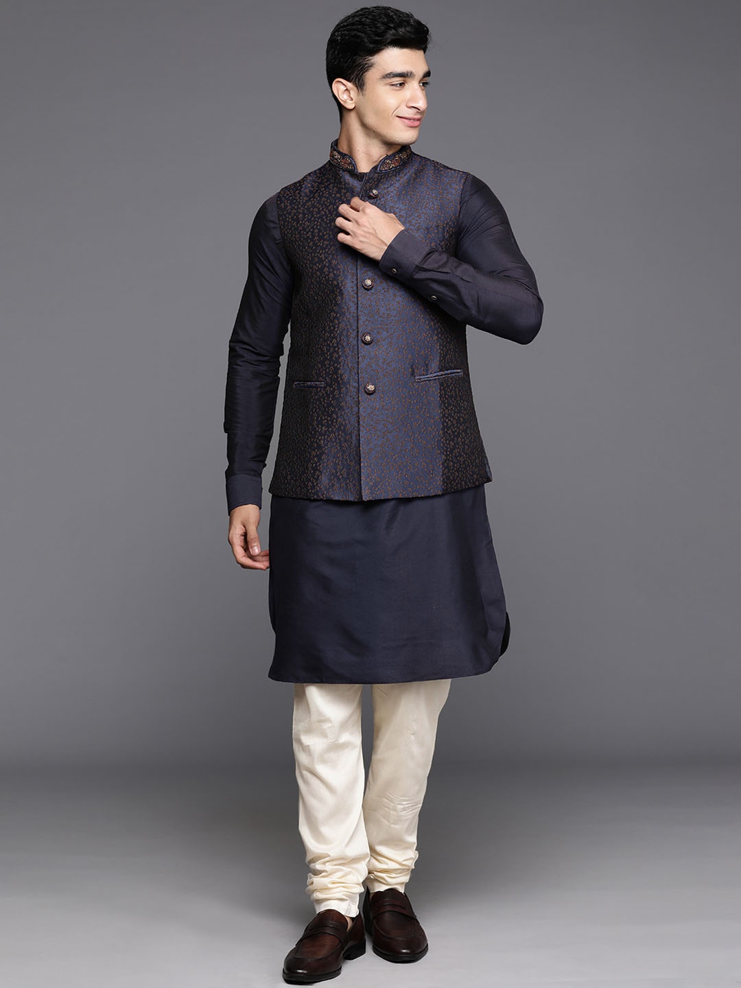 

Manu Men Solid Mandarin Collar Kurta With Churidar & Embroidered Nehru Jacket, Navy blue