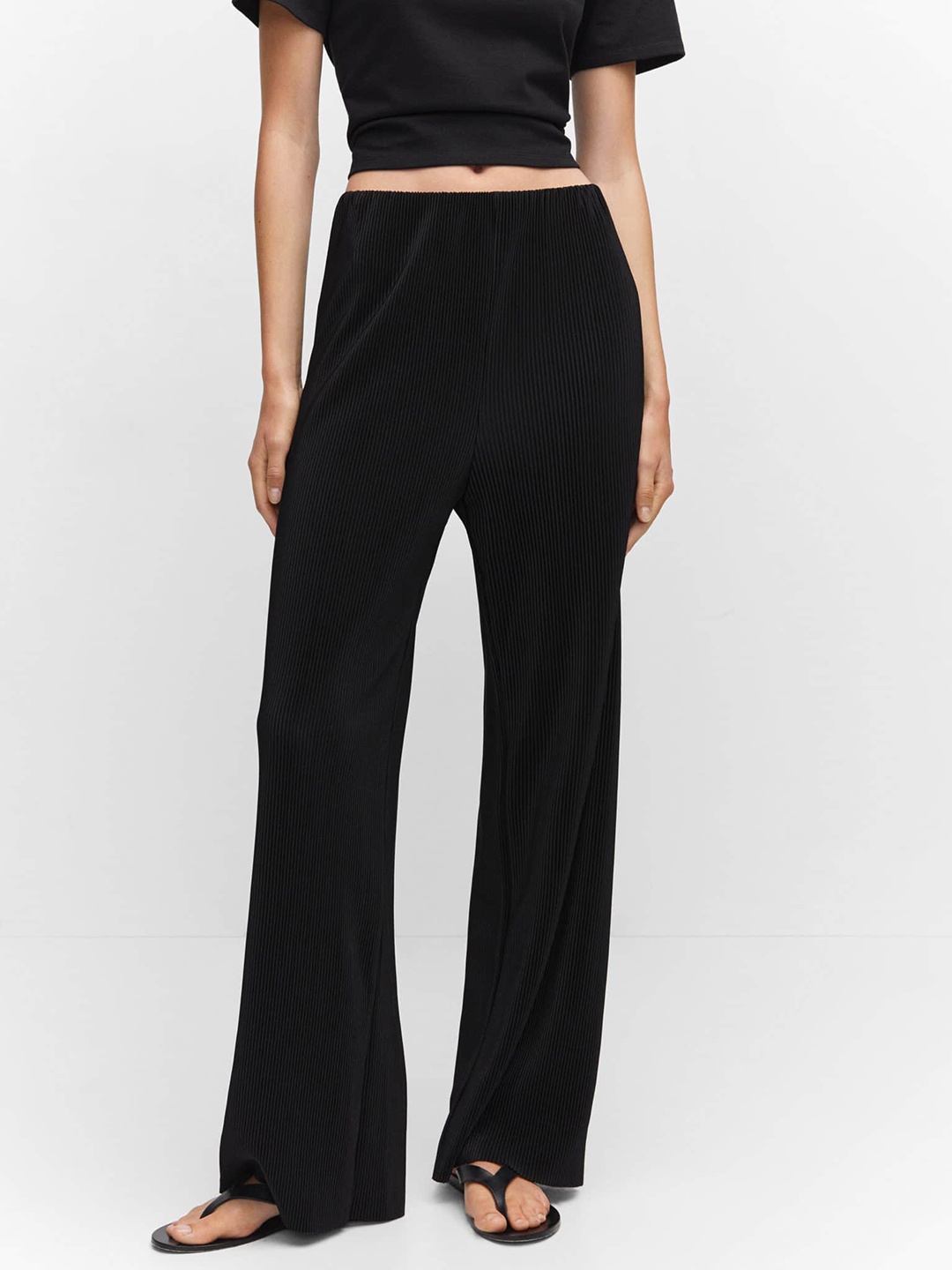 

MANGO Women Self-Striped Mid Rise Flared Trousers, Black