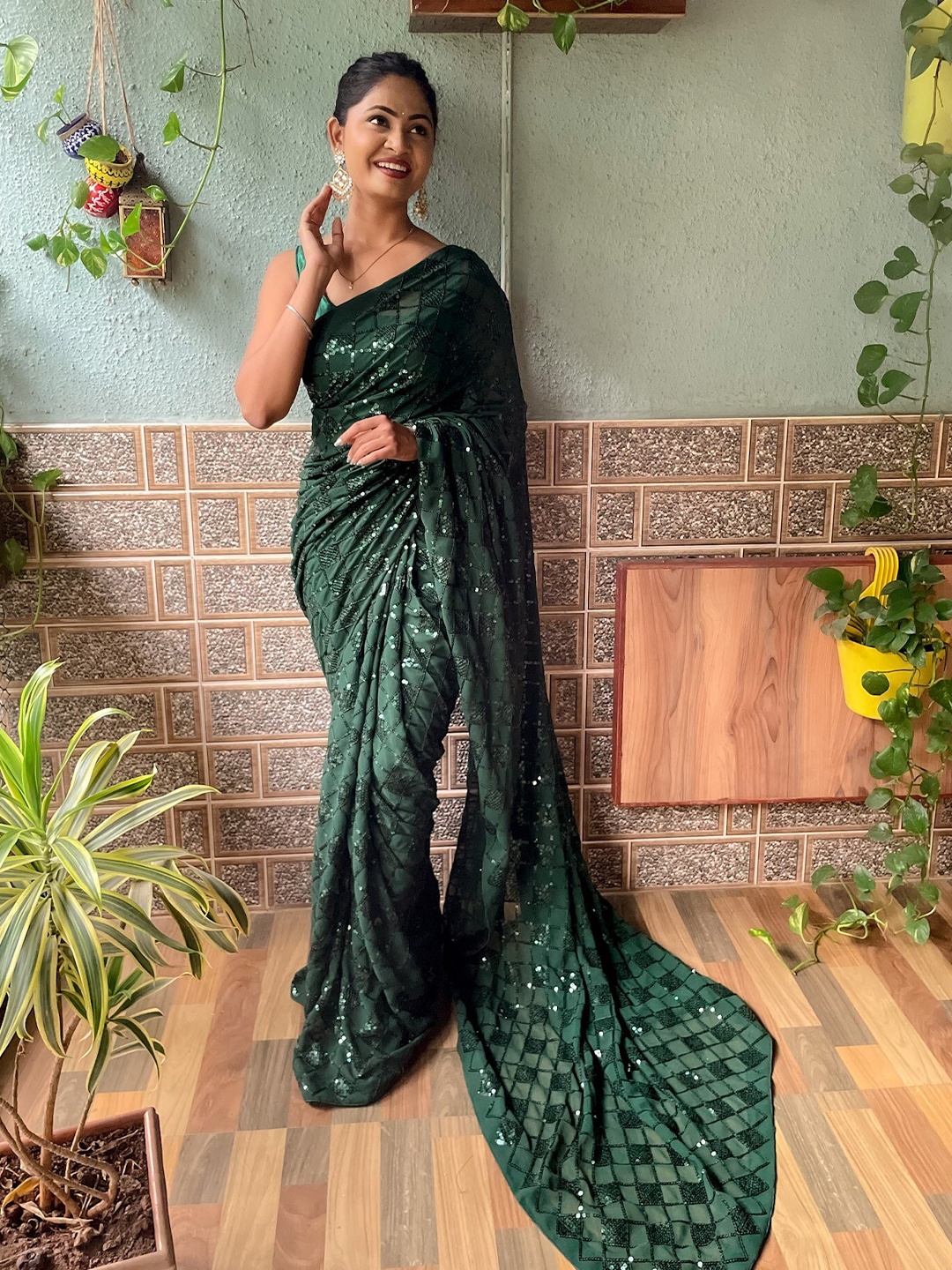 

Mitera Green Embellished Sequinned Saree