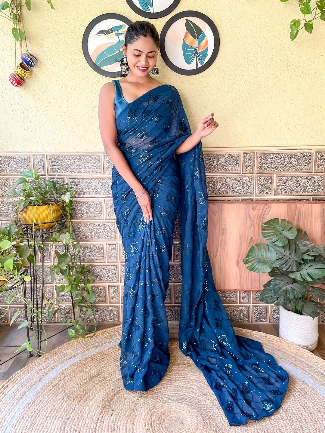 

Mitera Teal Sequinned Embellished Saree