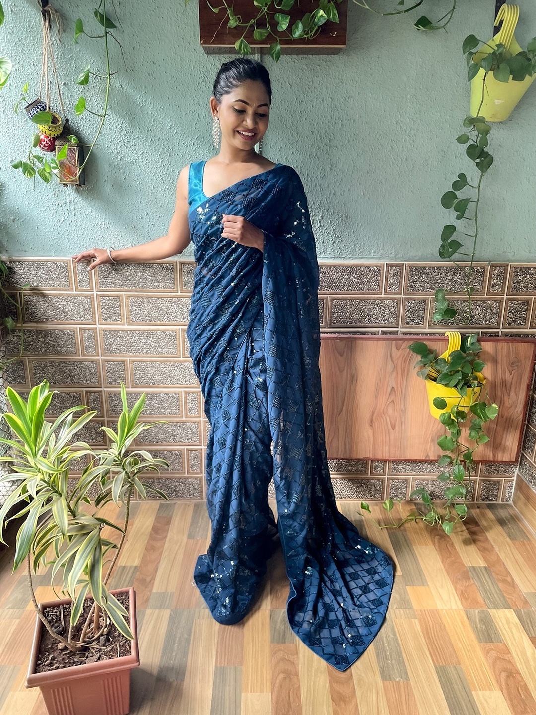 

Mitera Teal Blue Embellished Sequinned Saree