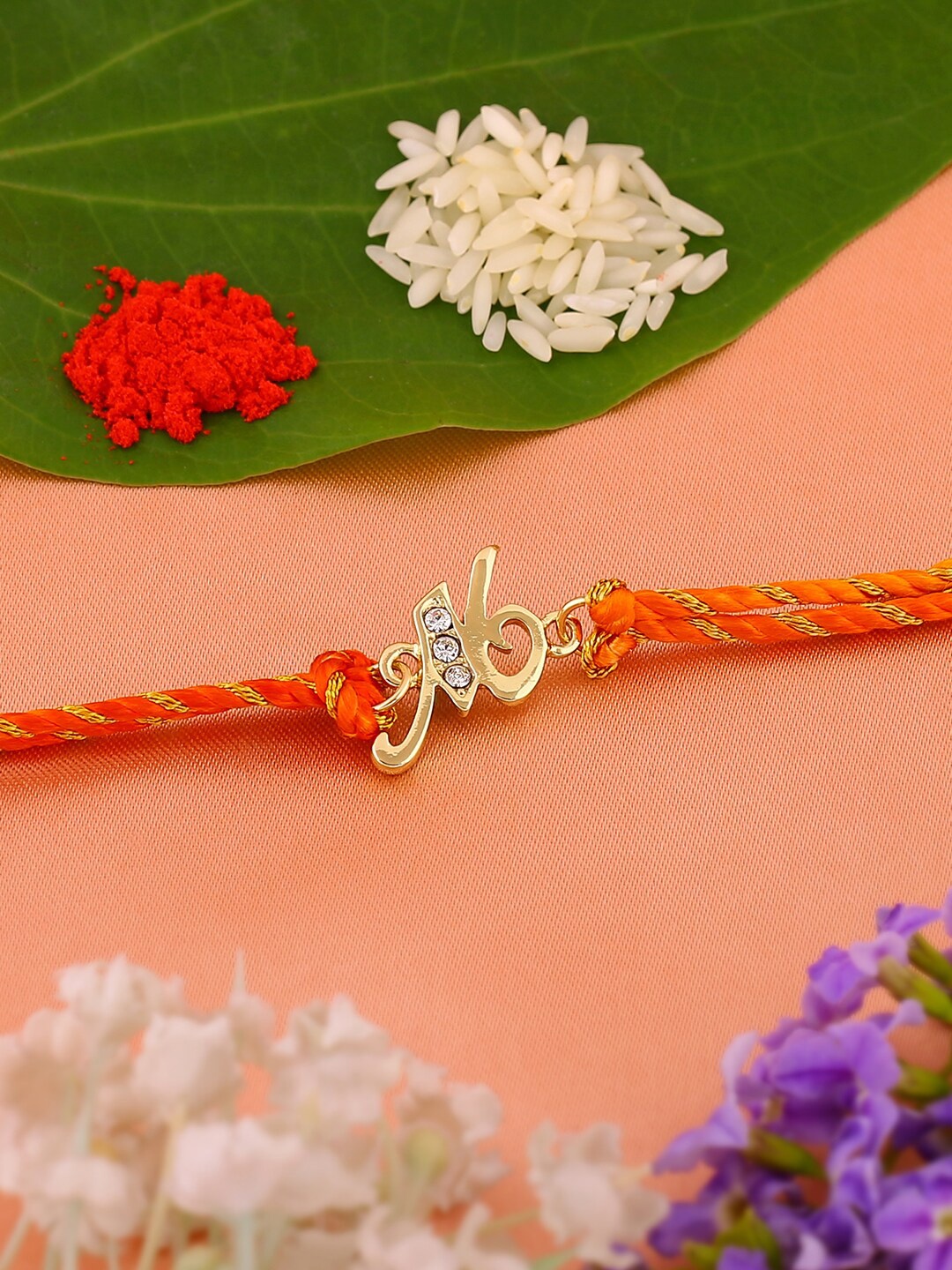 

Estele Gold-Plated Artificial Crystal-Studded Centrepiece Thread Rakhi