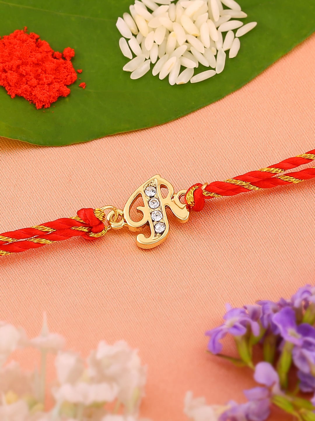 

Estele Unisex Gold-plated Crystal-studded Rakhi