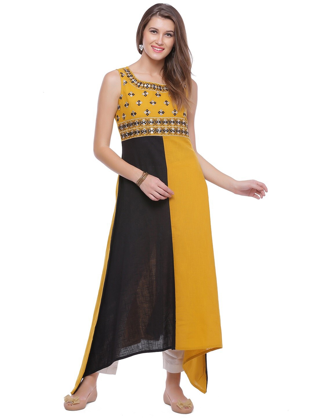 

Geroo Jaipur Colourblocked Thread Work A-Line Kurta, Yellow