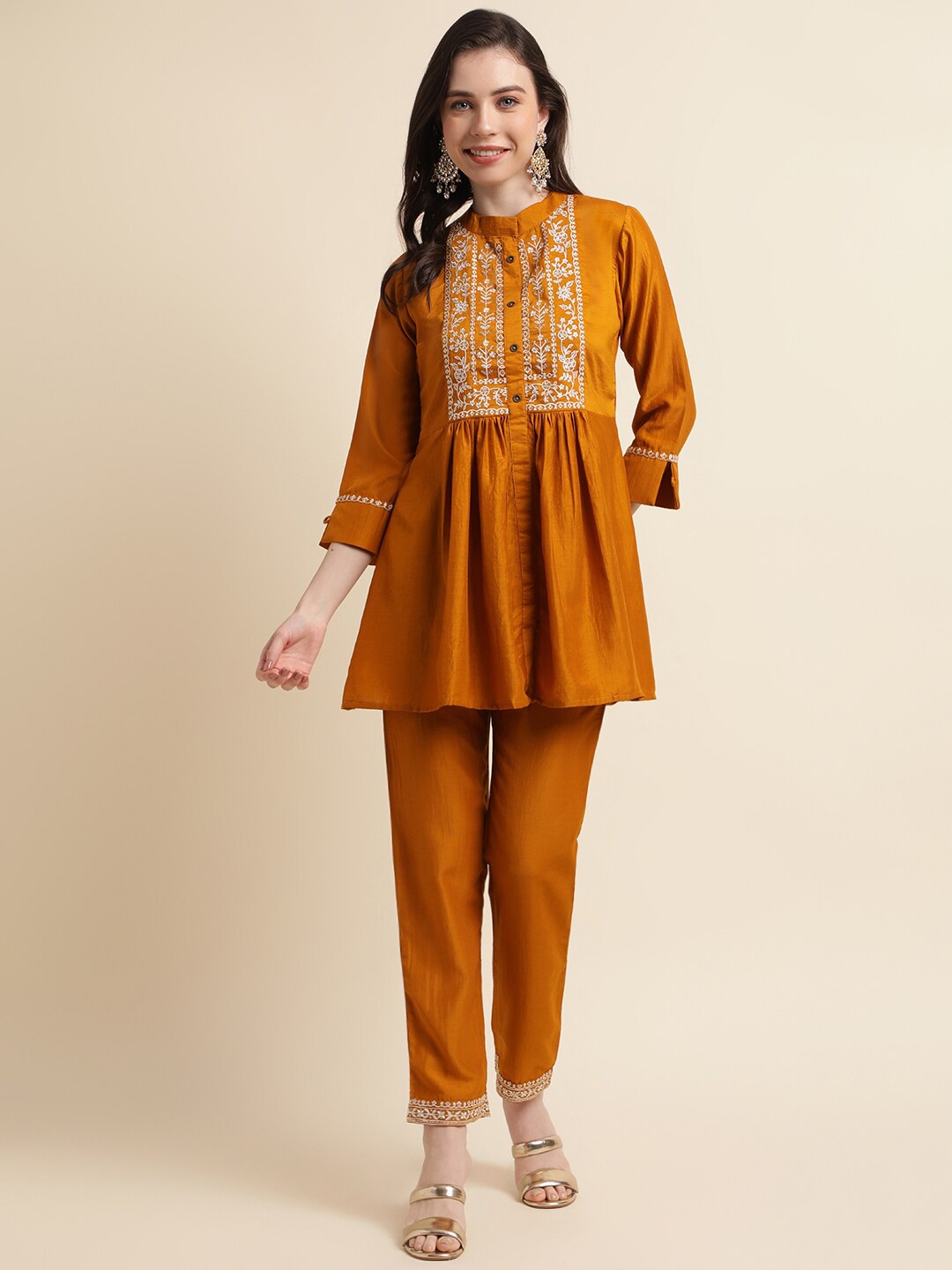 

Sangria Ethnic Motifs Embroidered Mandarin Collar A-Line Kurti With Trousers, Mustard