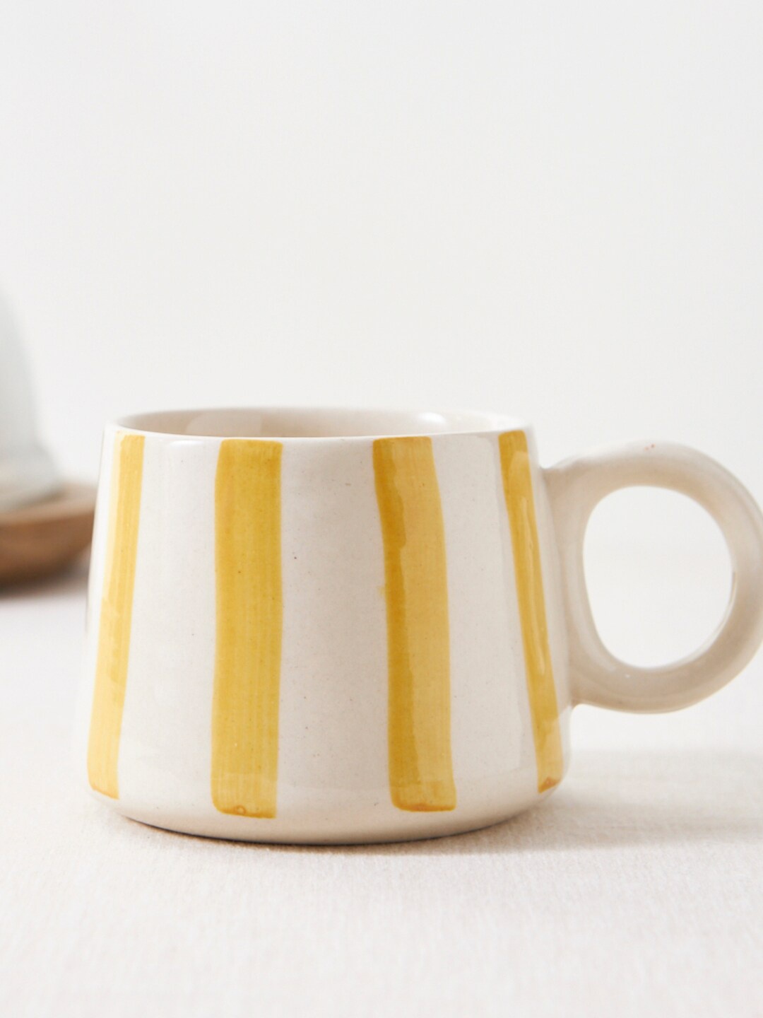 

Chumbak Yellow & White Printed Ceramic Matte Cup 200 ml