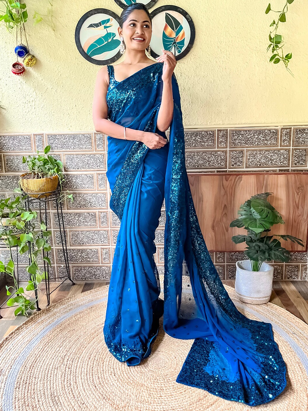 

Mitera Teal Blue Embellished Sequinned Poly Georgette Saree