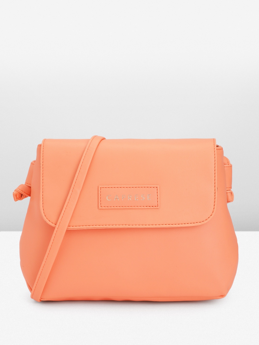 

Caprese Solid Structured Sling Bag, Coral