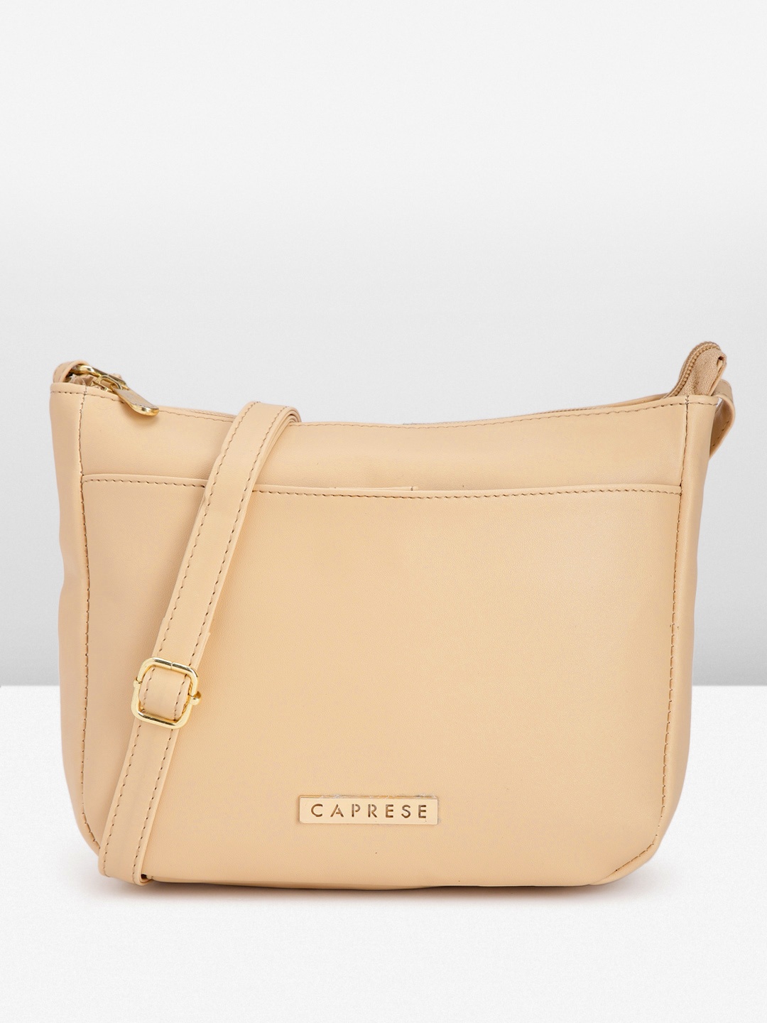 

Caprese Solid Structured Sling Bag, Beige