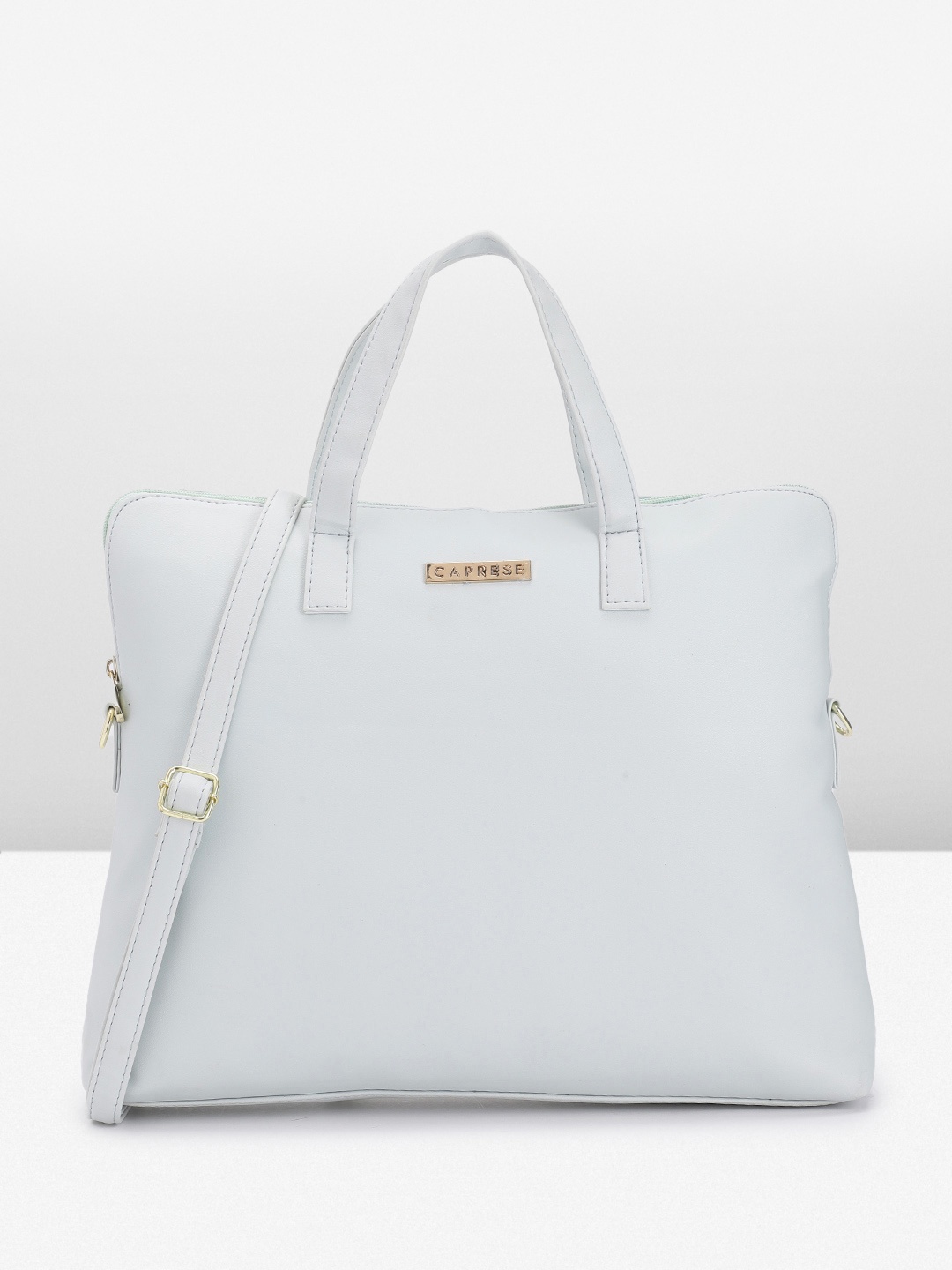 

Caprese Women Solid Laptop Bag, Blue