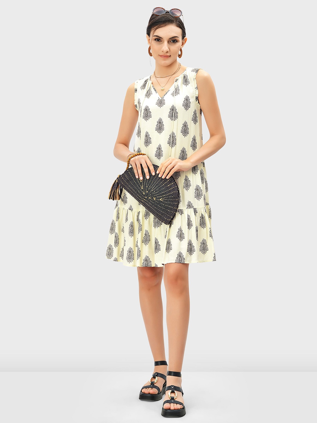 

Zapelle Ethnic Motifs Print Tie-Up Sleeveless A-Line Tiered Mini Dress, Beige