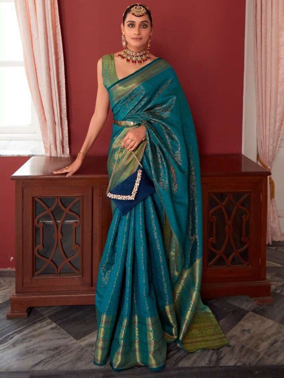 

Mitera Turquoise Blue & Gold-Toned Ethnic Motifs Woven Design Zari Banarasi Saree