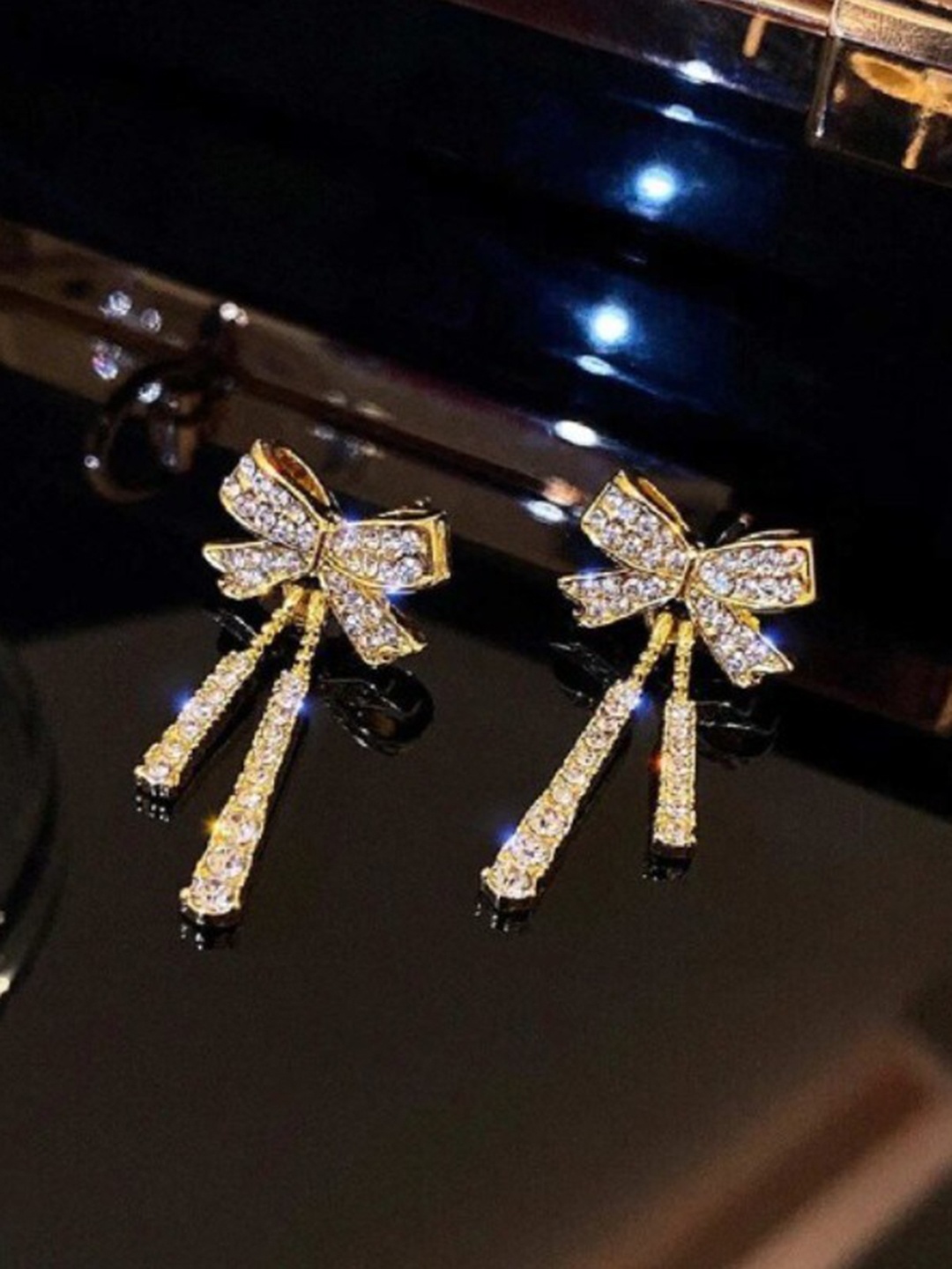 

SALTY Gold Shine Ribbon Bow Contemporary Studs Earrings