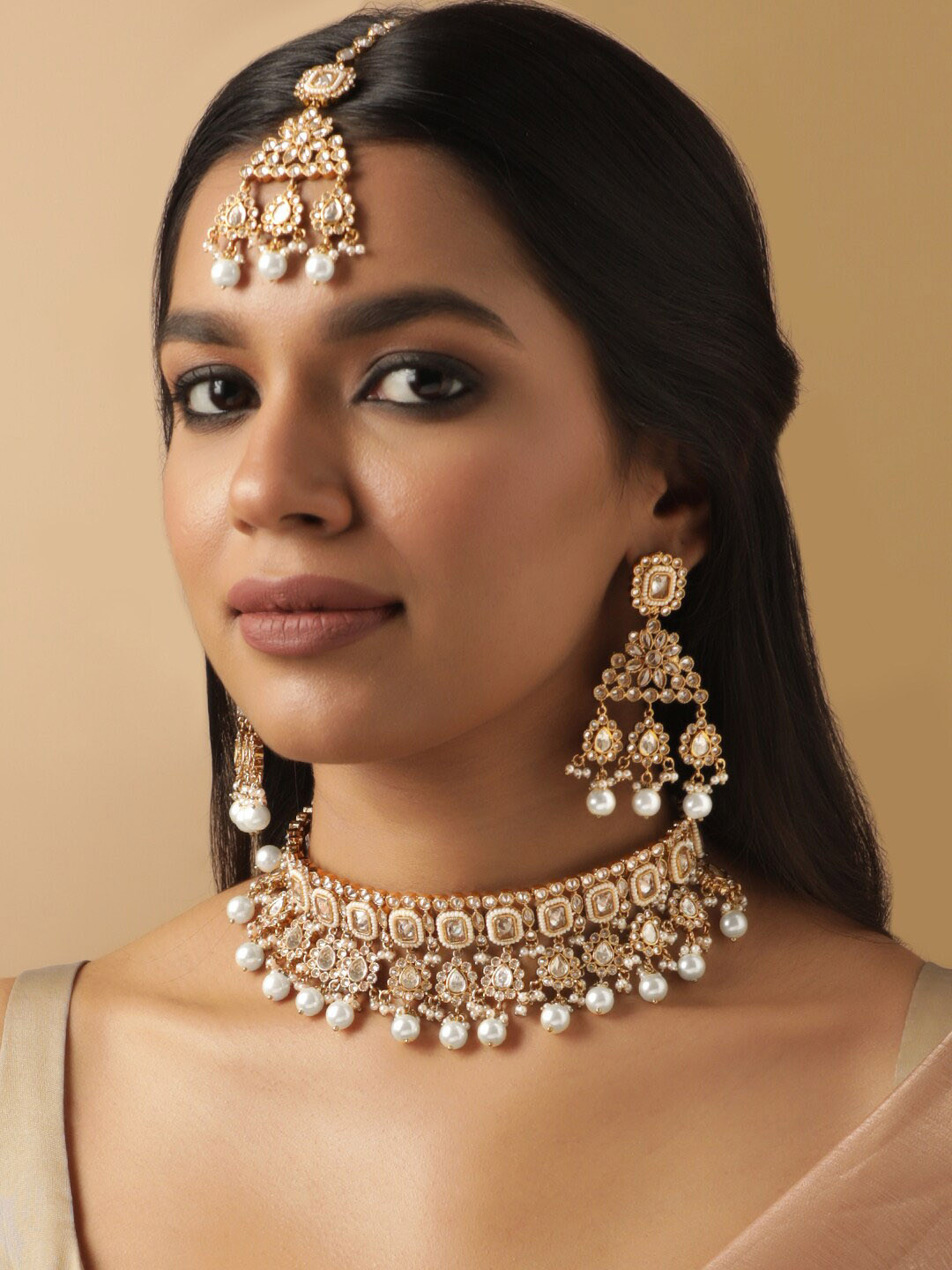 

Rubans Gold Plated Reverse AD Studded & Pearls Necklace and Earrings with Maang Tika