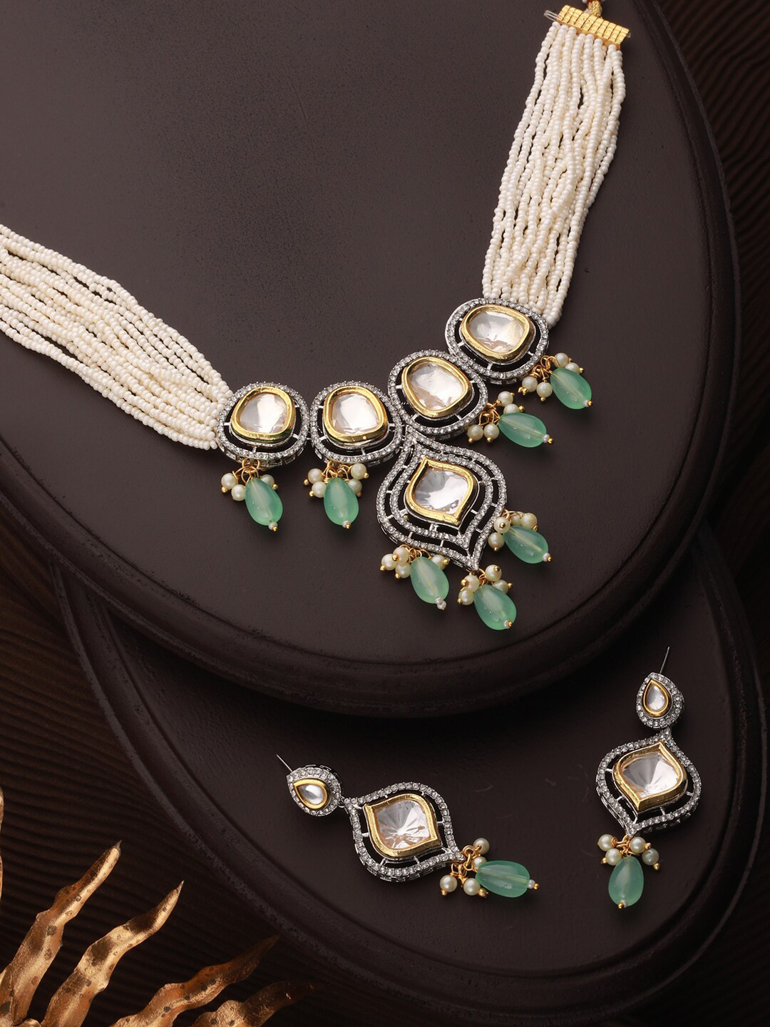 

Priyaasi Gold Plated Kundan Necklace and Earrings