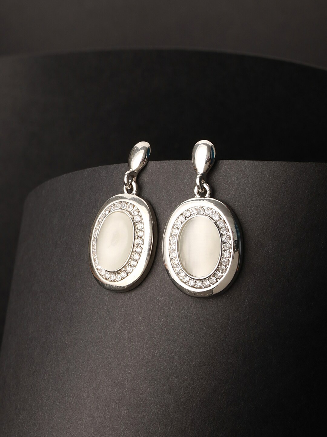 

Priyaasi Silver-Plated American Diamond Studded Oval Drop Earrings