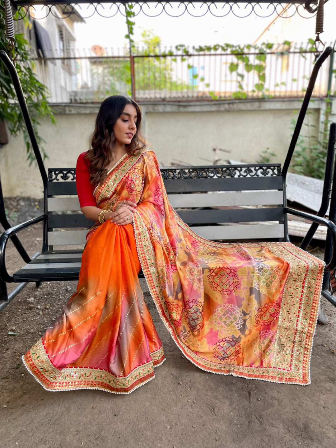 

Mitera Orange & Green Bandhani Printed Embroidered Pure Chiffon Saree