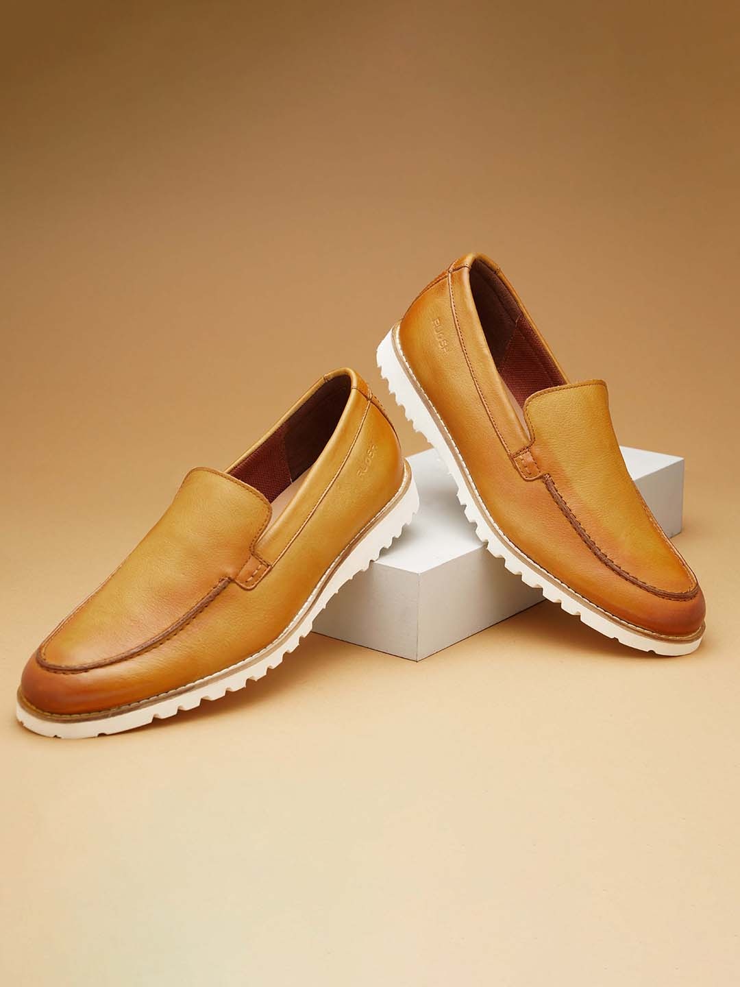 

Ruosh Men Contrast Sole Leather Loafers, Tan