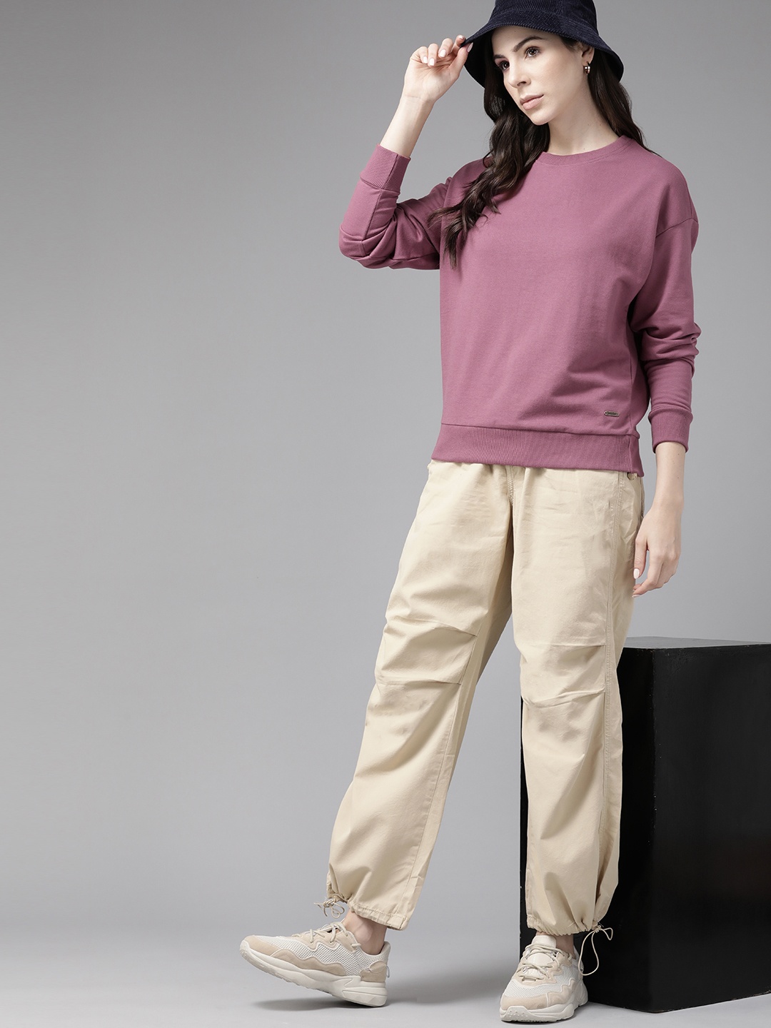 

Roadster Women Solid Sweatshirt, Mauve