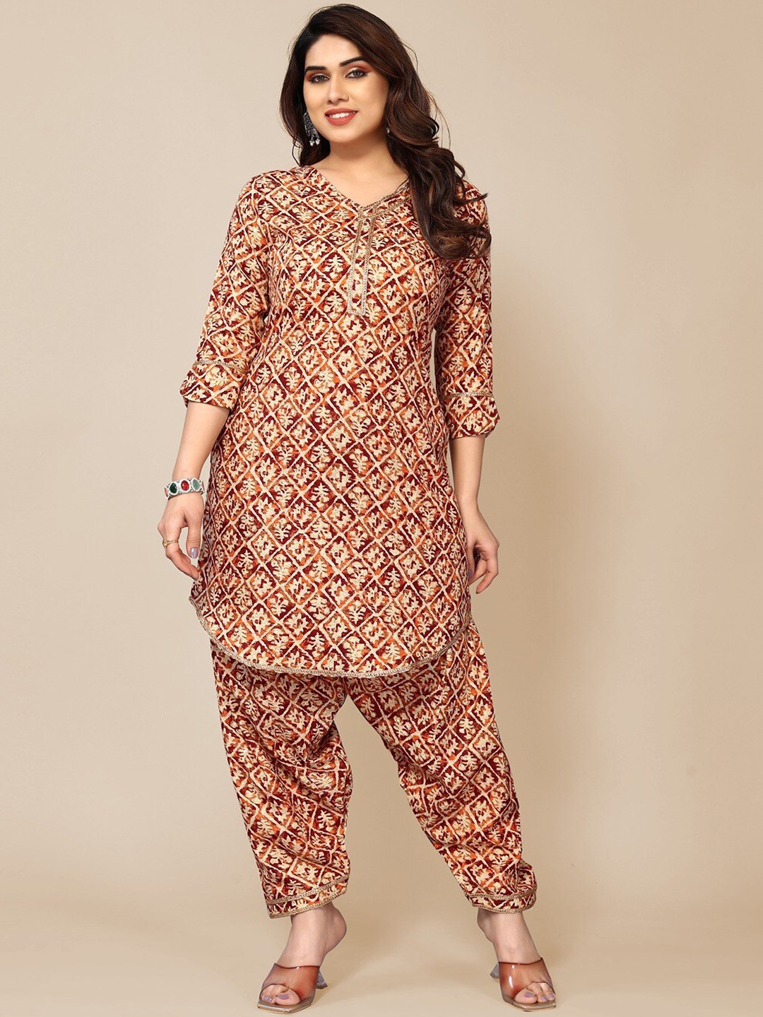

TITANIUM SILK INDUSTRIES PVT. LTD. Ethnic Motifs Printed V-Neck Kurta & Salwar, Orange