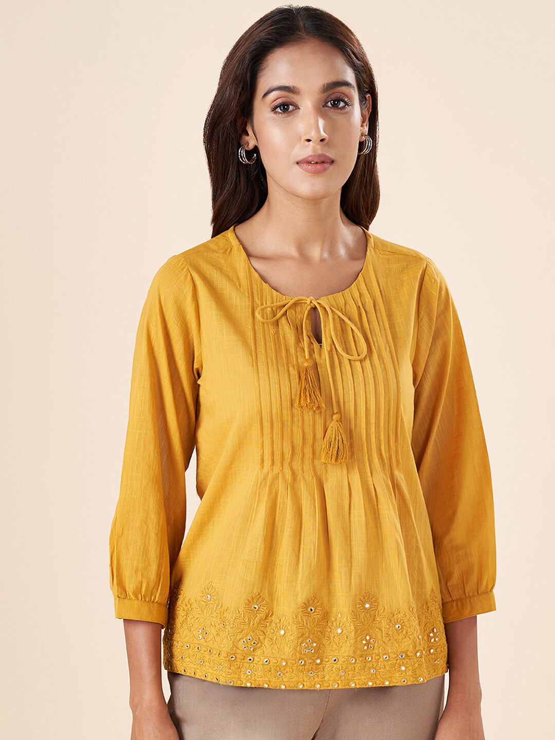 

AKKRITI BY PANTALOONS Floral Embroidered Mirror Work Cotton Tunic, Mustard