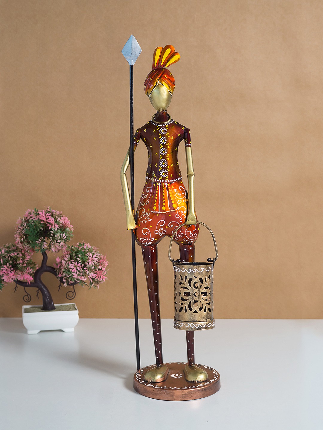 

Golden Peacock Brown Tribal Man Figurine Showpiece