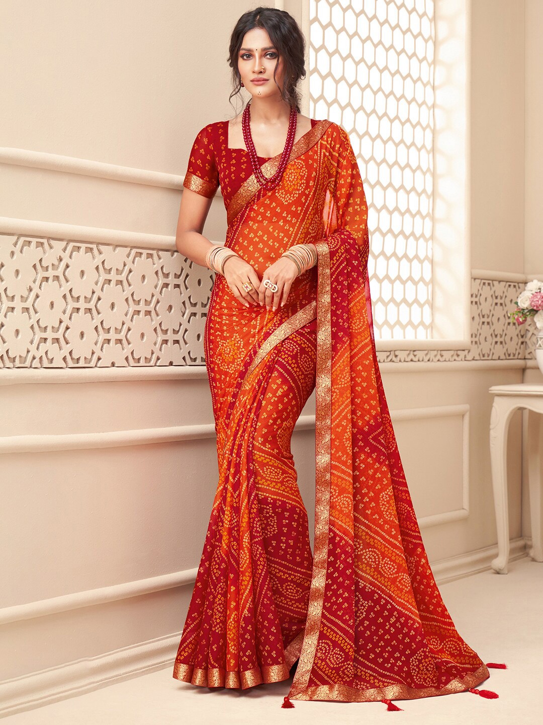 

Anouk Rustic Orange & Red Printed Zari Pure Chiffon Bandhani Saree