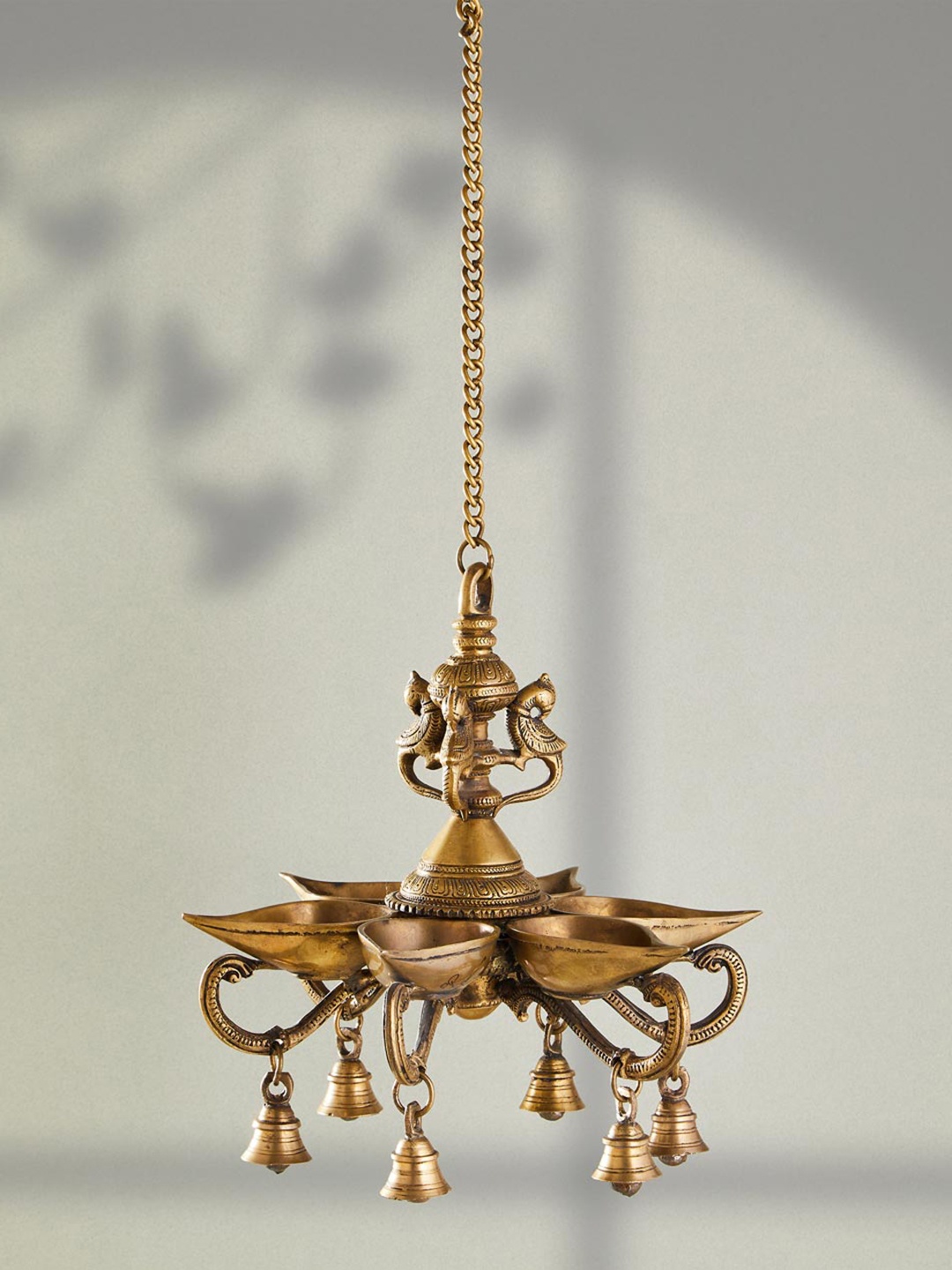 

Fabindia Golden Antique Brass Mehnoor Hanging Bird Oil Lamp, Gold