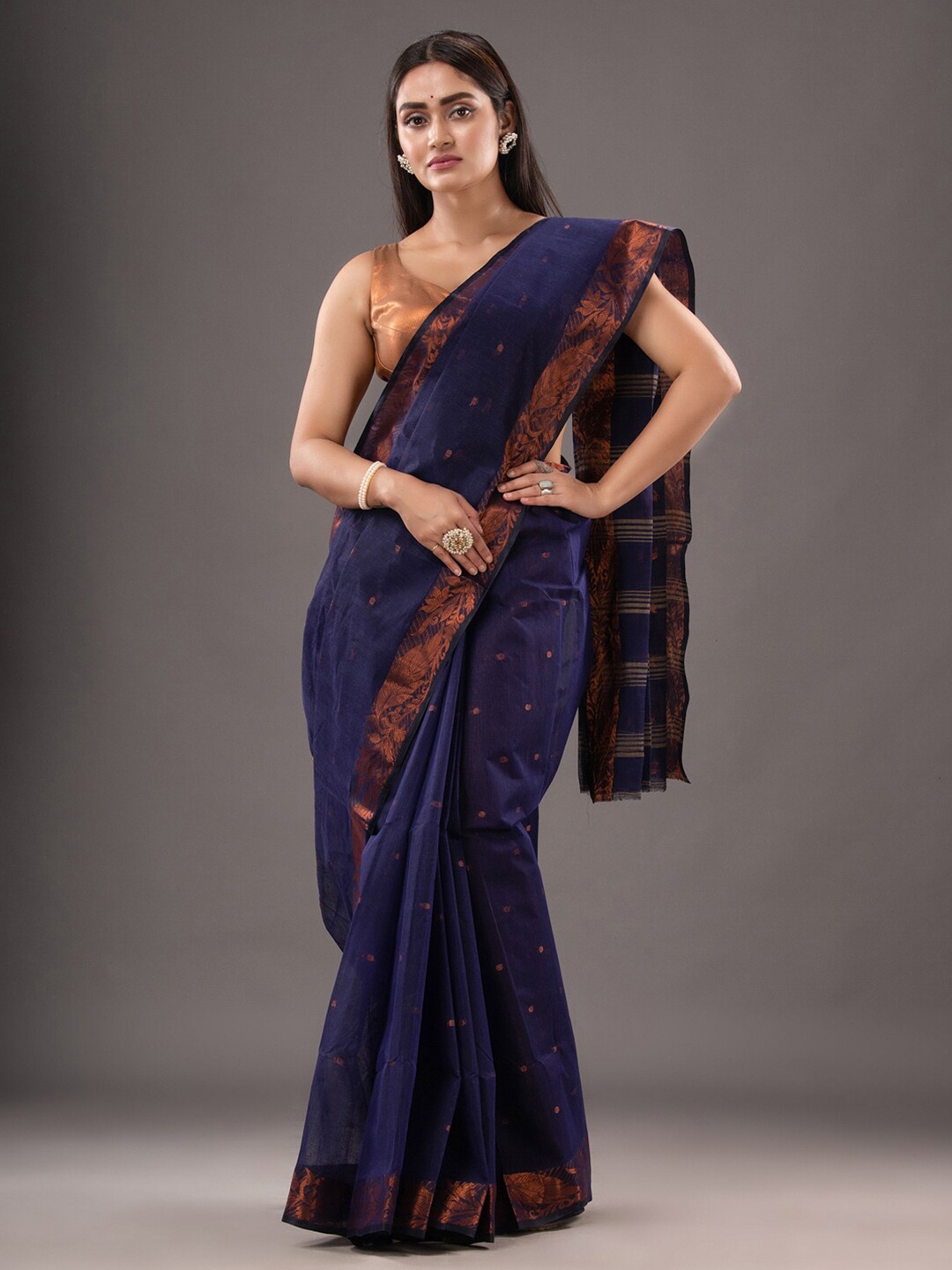 

Mitera Blue & Copper-Toned Ethnic Motifs Woven Design Zari Pure Cotton Taant Saree