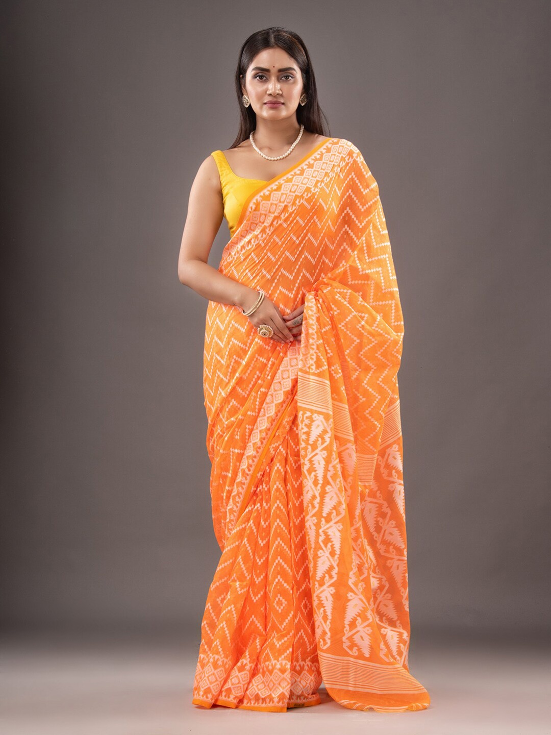 

Mitera Orange & White Woven Design Zari Silk Cotton Jamdani Saree