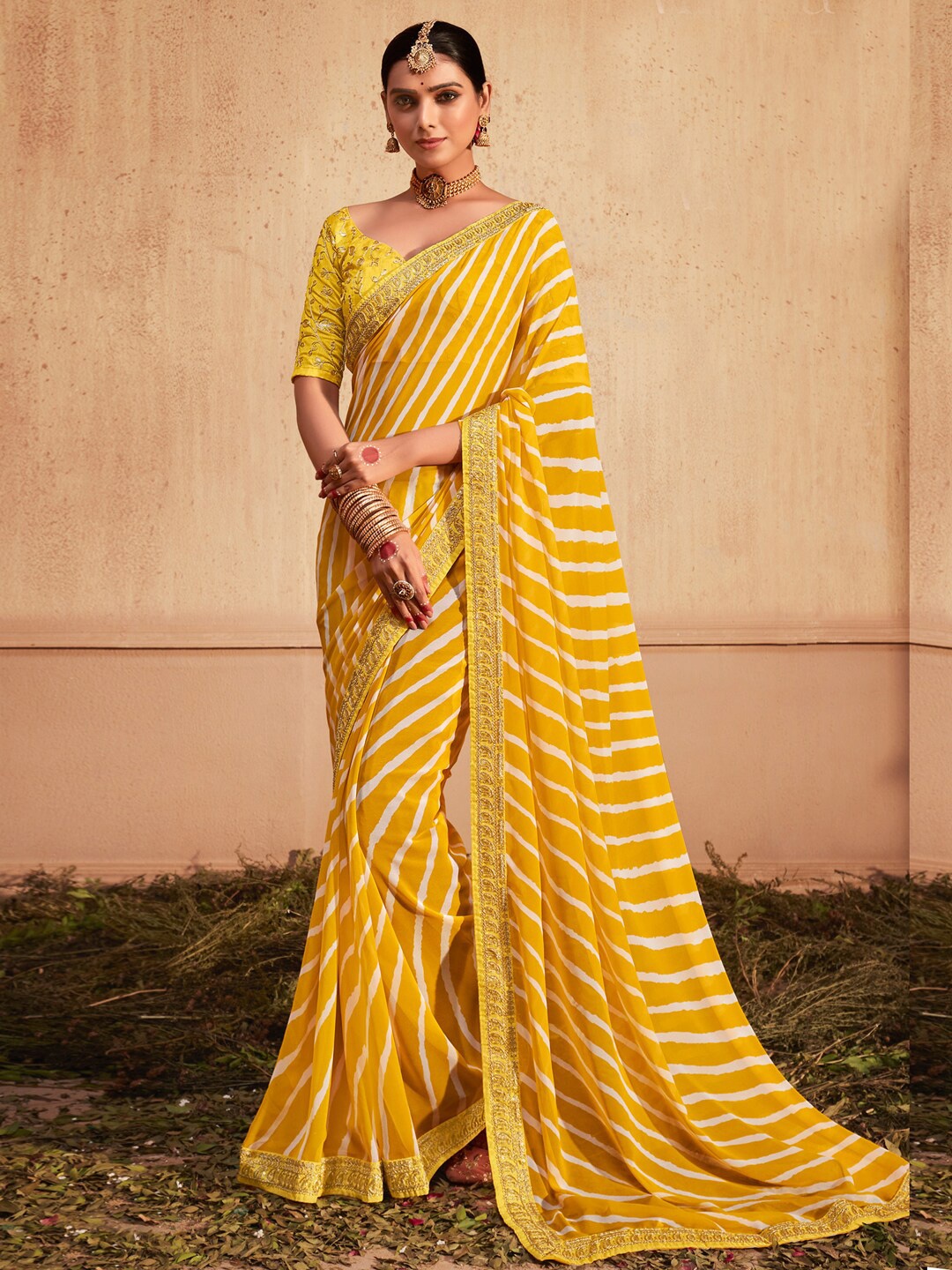 

Anouk Yellow Striped Embroidered Pure Georgette Leheriya Saree