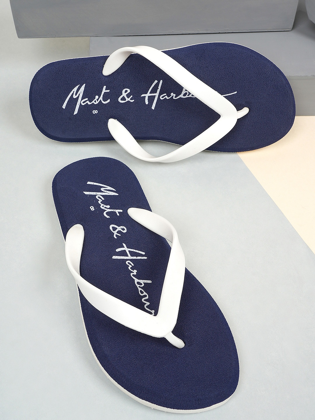 

Mast & Harbour Men Navy Blue & White Printed Lightweight Thong Flip-Flops