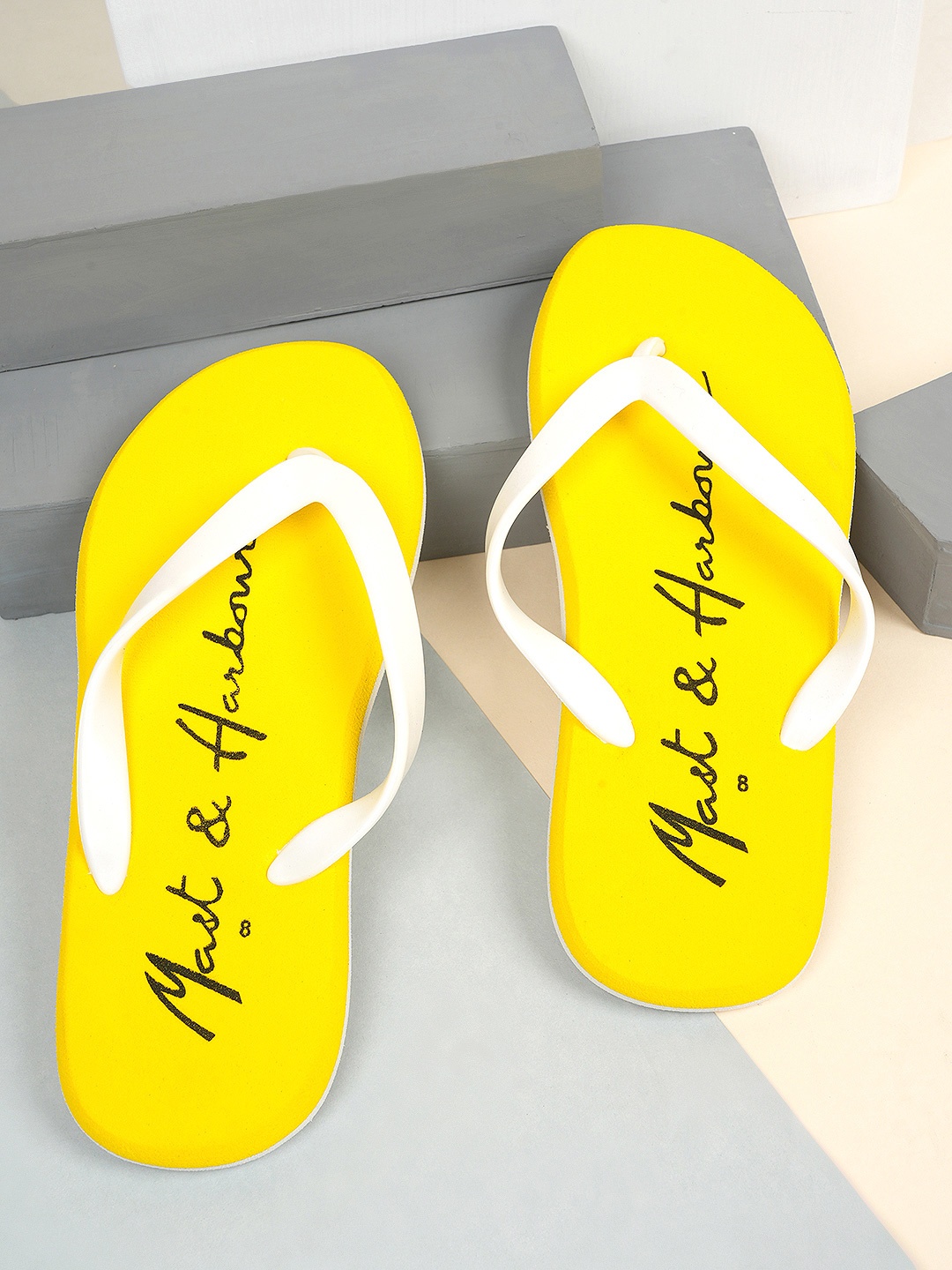

Mast & Harbour Men Yellow & White Printed Lightweight Thong Flip-Flops