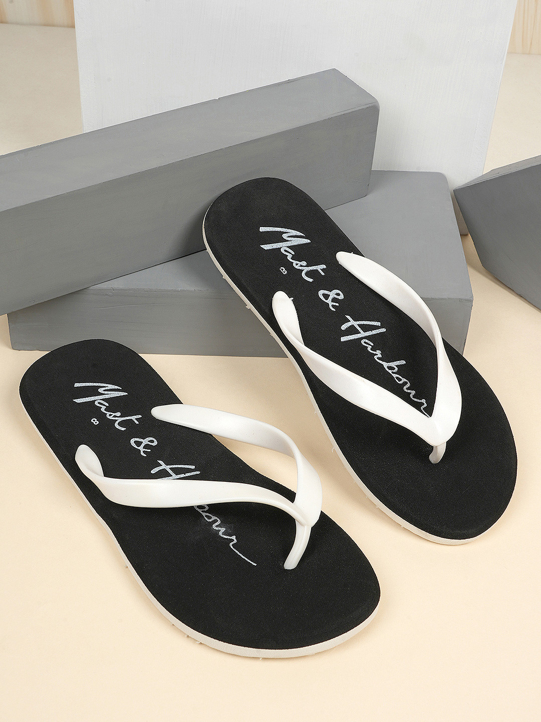 

Mast & Harbour Men Black & White Printed Lightweight Thong Flip-Flops