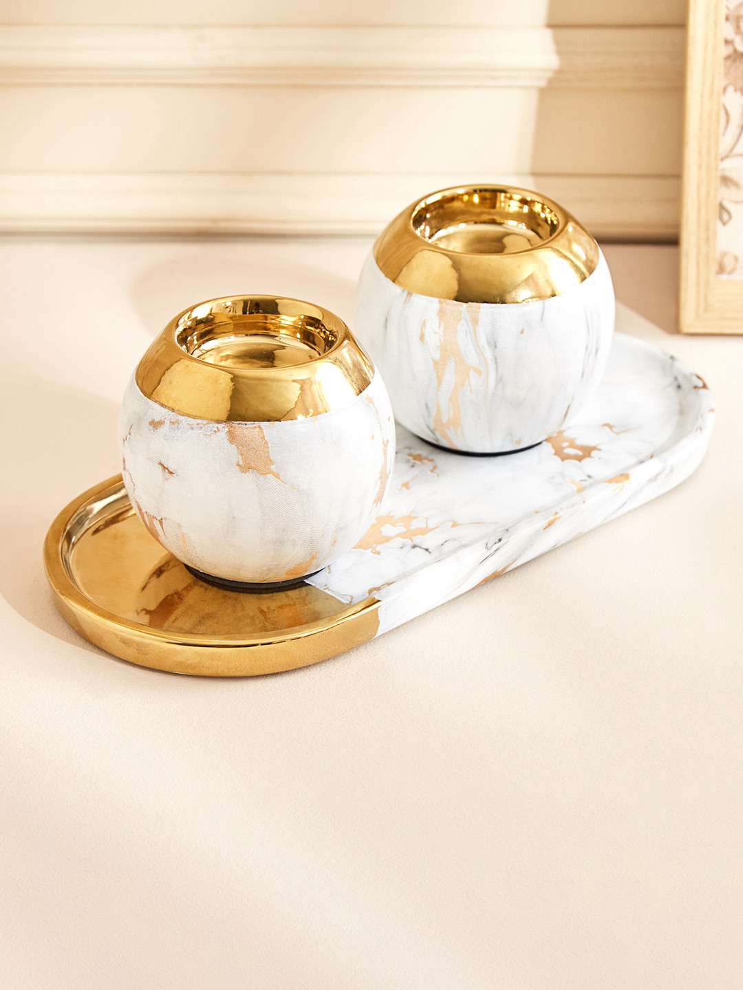

Home Centre Krater Gold Toned & White 2 Pieces Oval T-Light Holders With Tray