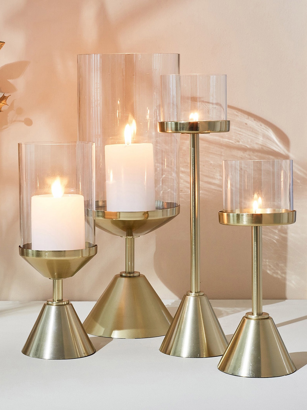 

Home Centre Splendid Terra Roza Gold-Toned & Transparent Glass Hurricane Candle Holder